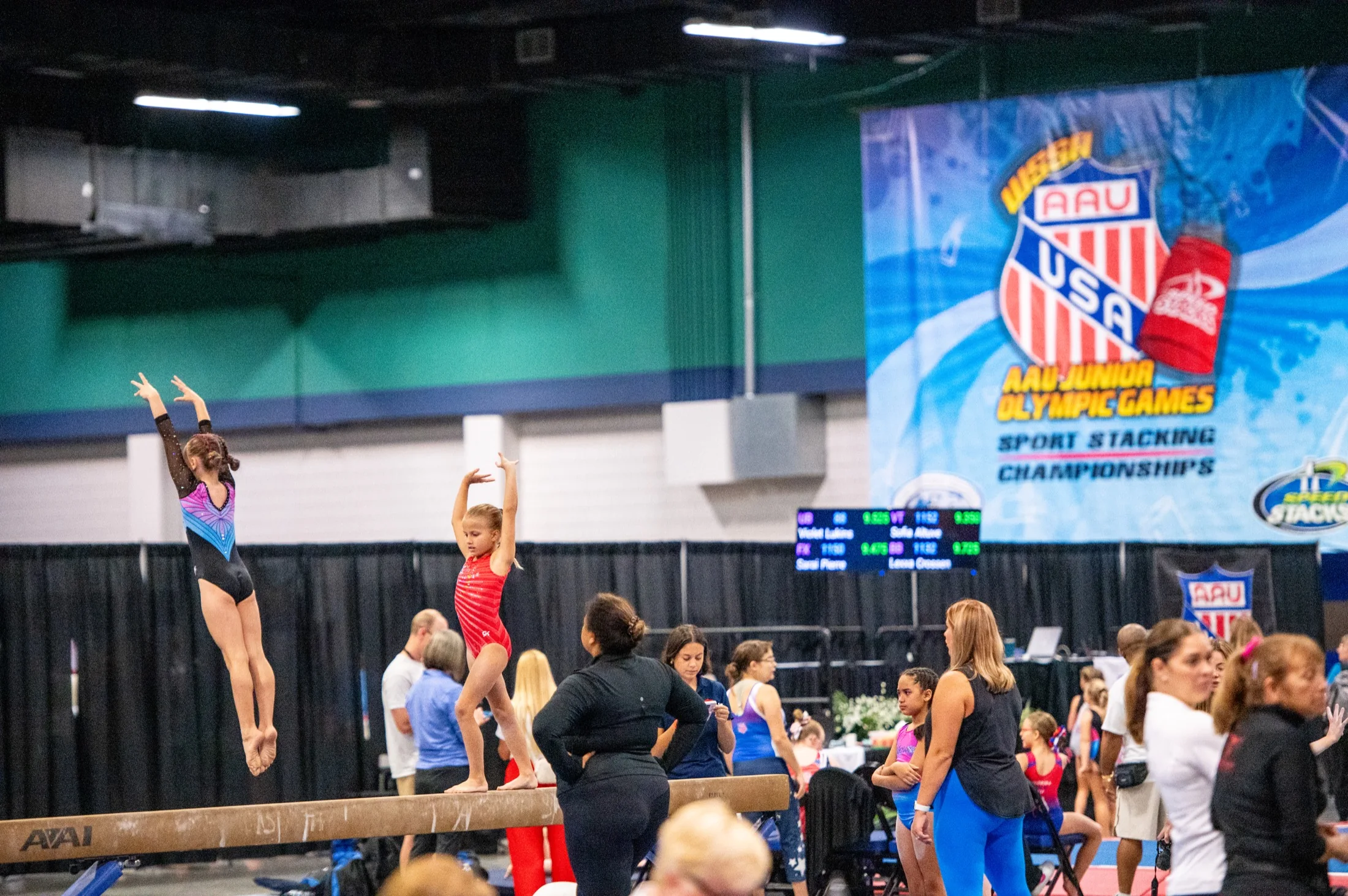 Young gymnasts compete during a championship event in Greensboro