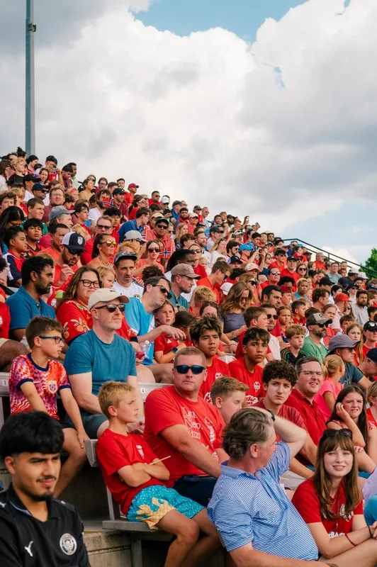 Families and supporters filling the stands at the FIFA Team Norway open practice in Greensboro