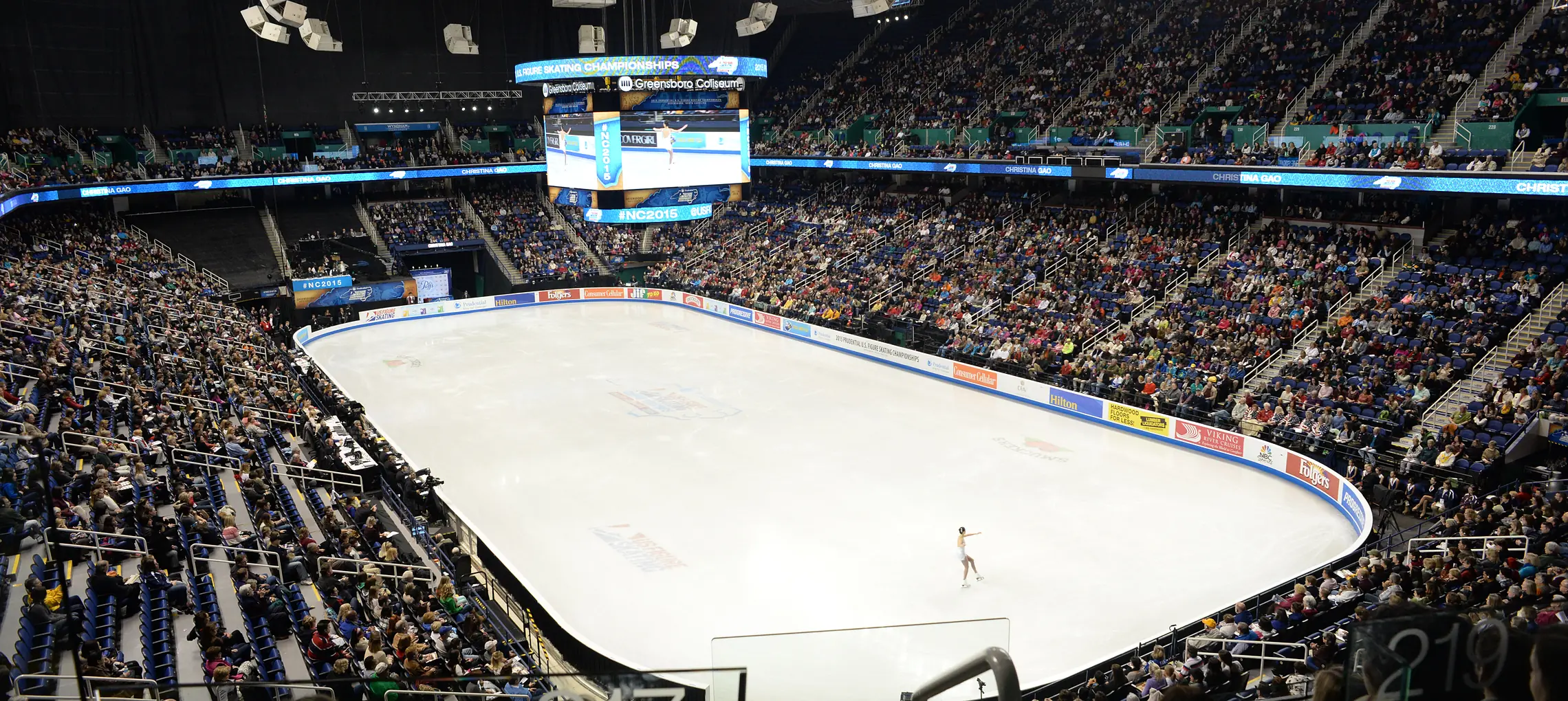A capacity crowd at First Horizon Coliseum watching a solo skater at the U.S. Figure Skating Championships