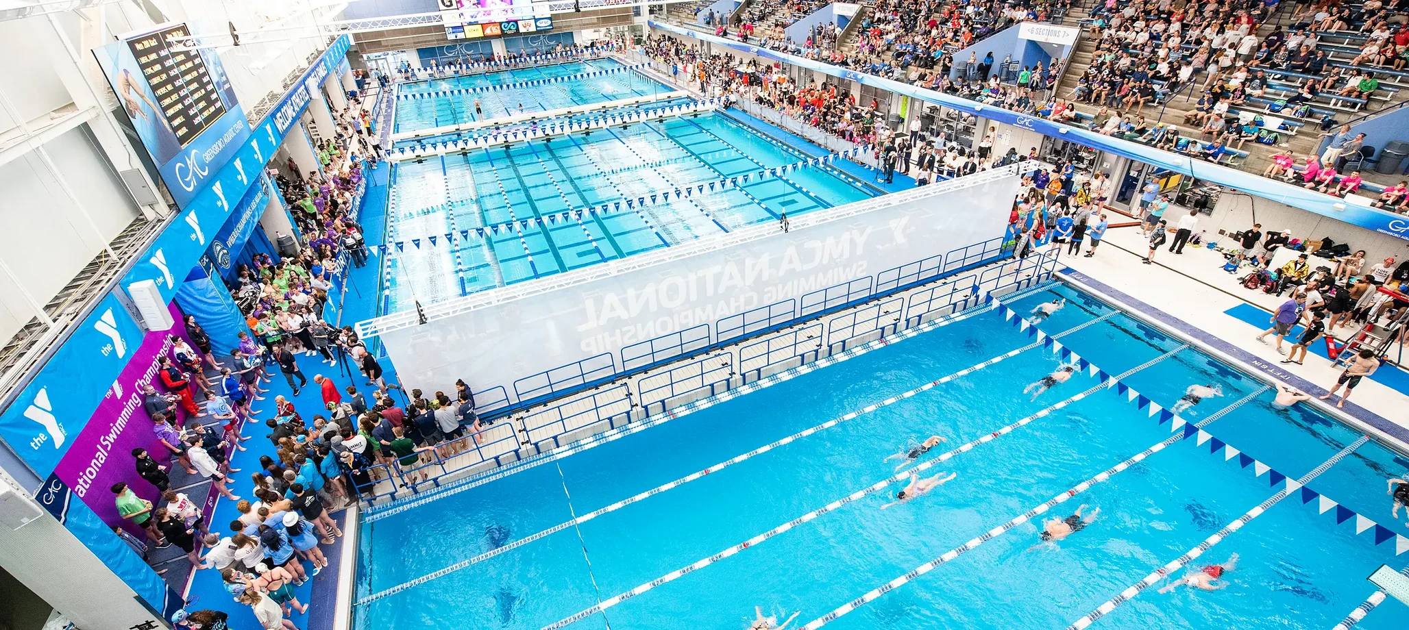 National championship swimming fills the competition pools at Greensboro Aquatic Center
