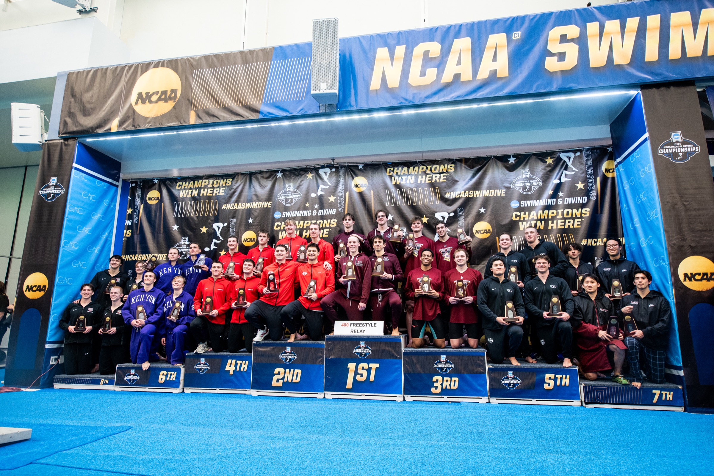 NCAA swimming and diving championship medalists gathered on the awards podium