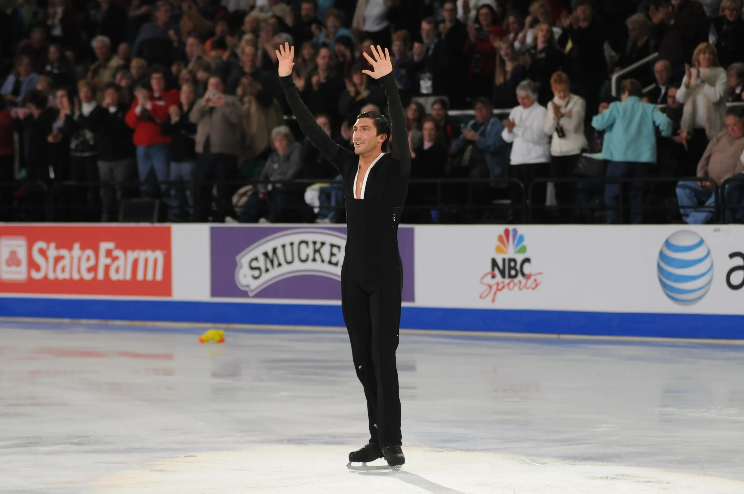 Olympic champion Evan Lysacek waves to the crowd from the ice in Greensboro