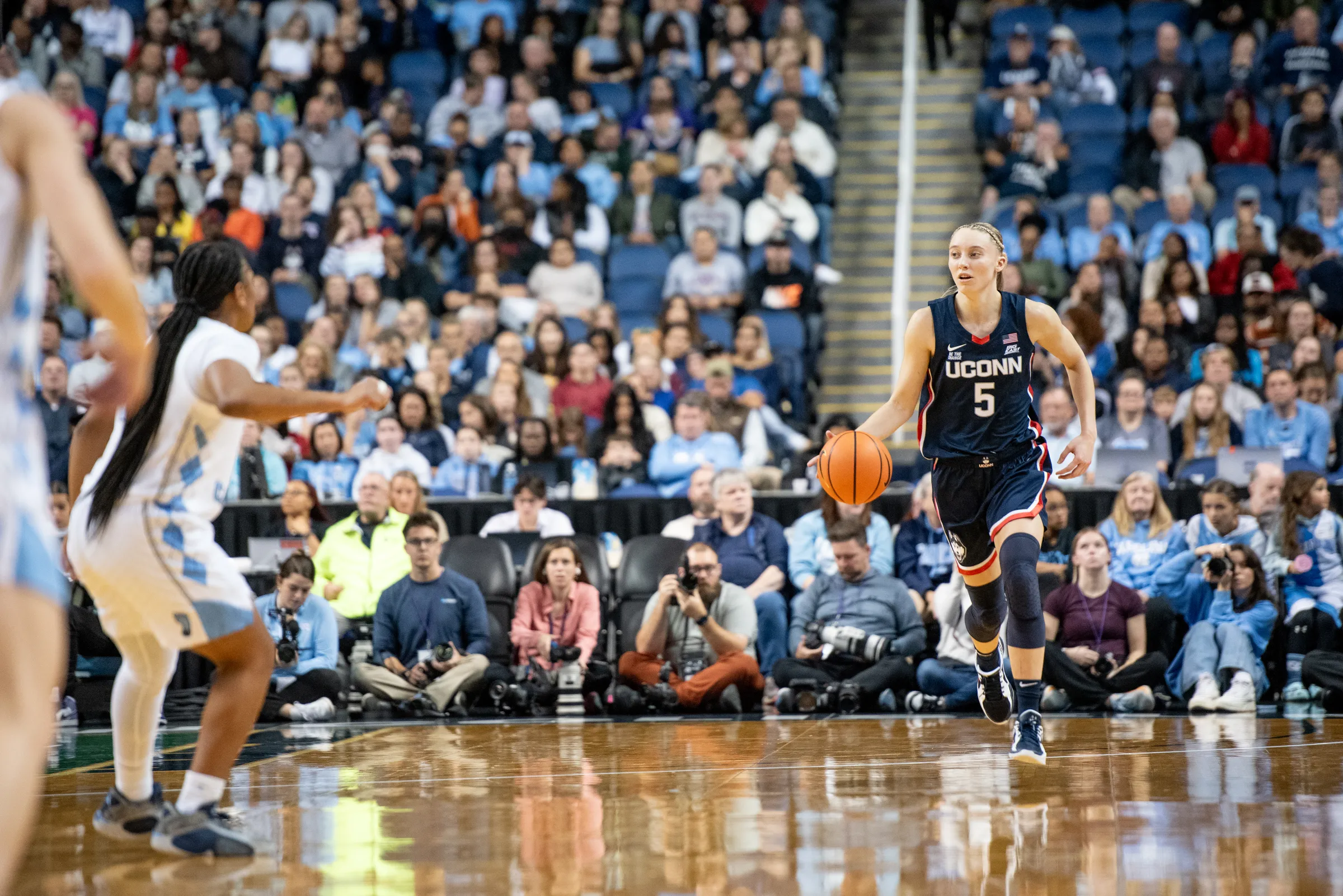 Paige Bueckers of UConn brings the ball up the court against North Carolina in Greensboro